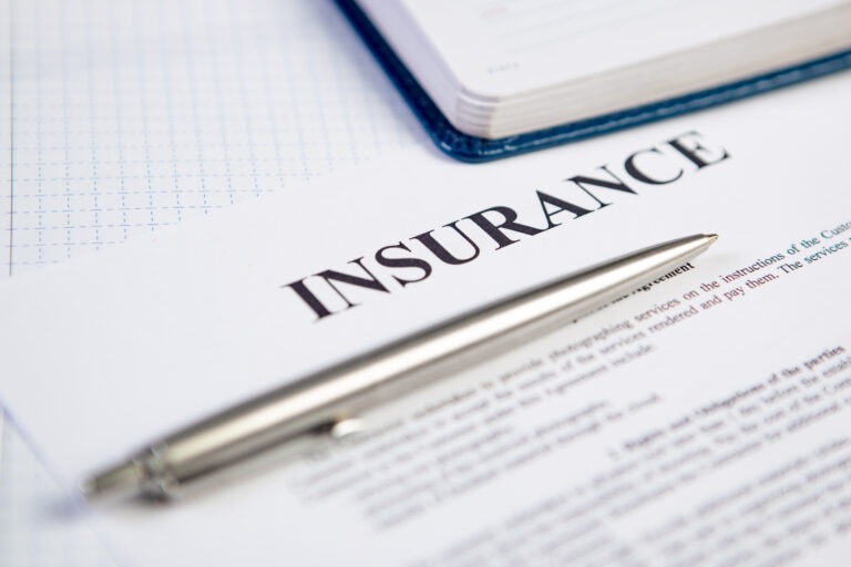 closeup silver ballpoint modern pen insurance contract with planning background Can International Students Waive UC SHIP at UCLA or UC Davis in 2026-2027?